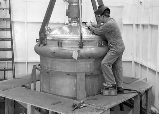 Image of man welding on the molten salt reactor experiment
