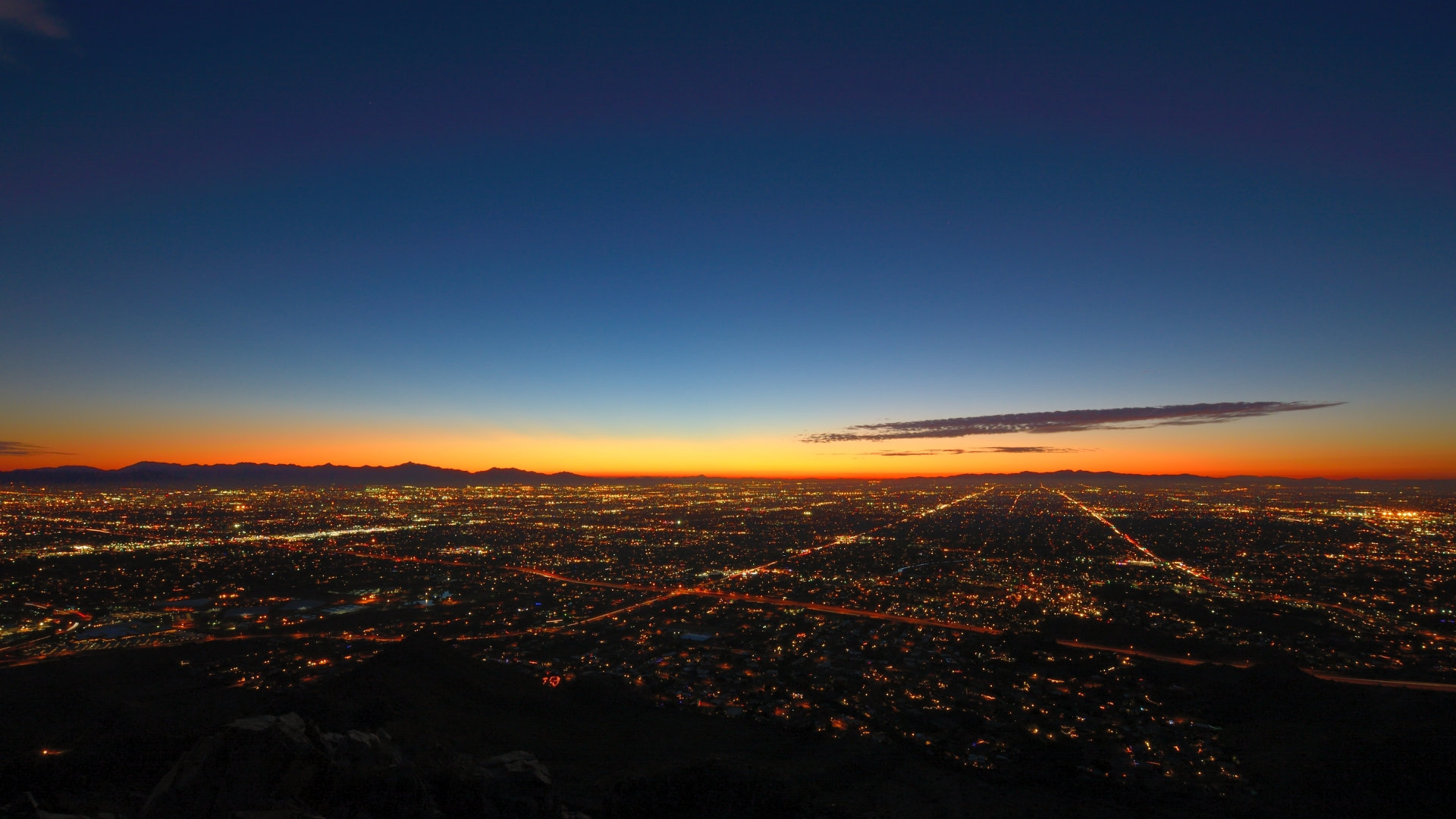 Image of sprawling city lights at dusk