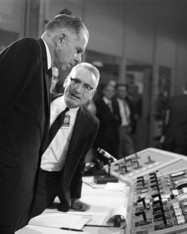 Alvin Weinberg standing beside Glenn Seaborg at the MSRE controls